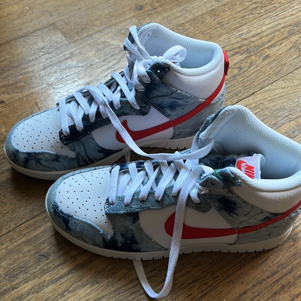 Nike high top Dunks with denim accents. Never worn. Still has tags.